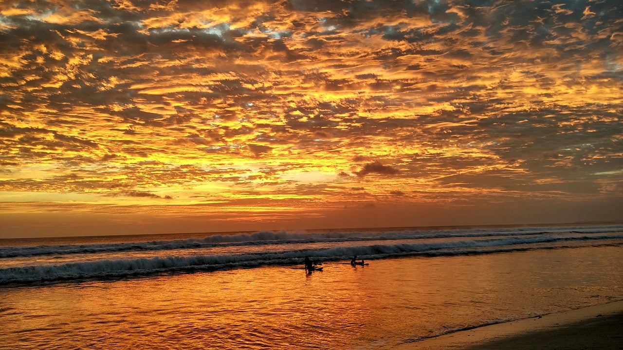 Bali Sunset with surfers enjoying the last natural light of the day